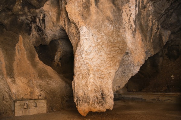 Dramatic limestone formation in a cave with strong textures, Church of Mary the Fountain of Life,