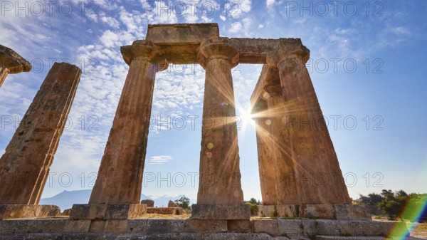 Archaic Temple of Apollo, Doric columns, Rays of light breaking through the columns of a ruined