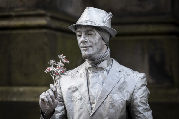 Street artists sprayed with silver paint, world's largest cultural festival The Fringe, High