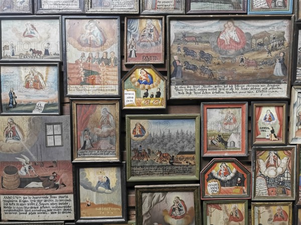 Votive pictures, votive tablets on the walls of the chapel of grace inside the church, pilgrimage
