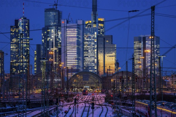 Railway tracks in front of the main railway station in Frankfurt am Main, skyline of skyscrapers in