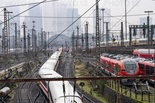 Railway tracks with regional and long-distance trains, ICE, after freezing rain, in front of