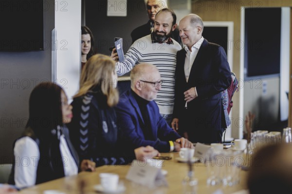Olaf Scholz (SPD), Federal Chancellor, at a meeting with migrants and people involved in the field