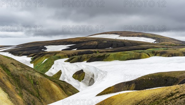 Colourful volcanic landscape with hills and snow, Laugavegur trekking trail, Landmannalaugar,
