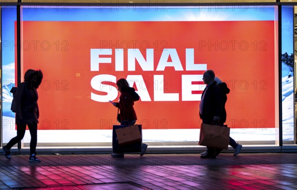 Final Sale, Clothing department stores' on Schadowstraße, large poster in the shop window