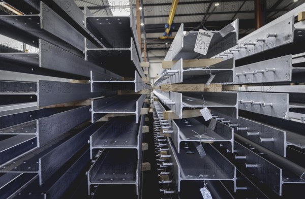 Finished galvanised steel parts lie in the factory hall of the surface finishing company Coatinc
