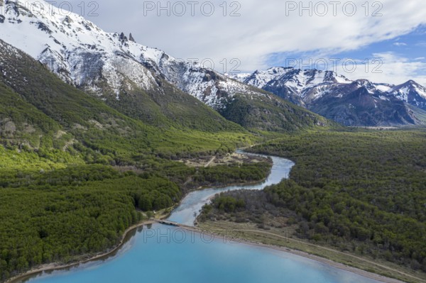 Aerial view of lake Lago Jeinimeni, river flowing out of the lake, glacial blue water in contrast