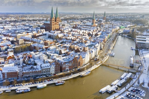 Aerial view over the river Trave and church towers in the old town of the Hanseatic City of Lübeck