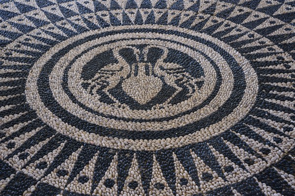 Detail of an artistically designed mosaic with a symmetrical pattern in black and white, thermal