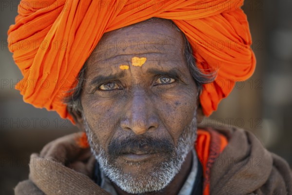 Man with orange turban and yellow bindi on his forehead, portrait, Chittorgarh Fort, Chittorgarh,