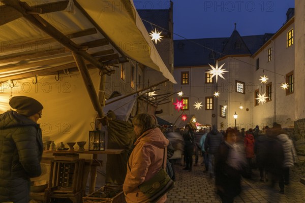 Christmas market with stalls in the castle courtyard of Schwarzenberg Castle, Erzgebirge, Saxony,