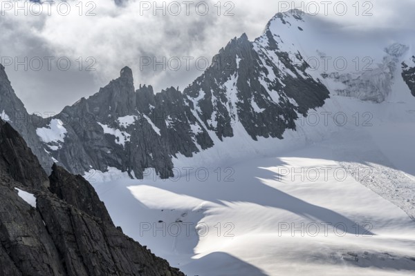 Mountain landscape with rock and snow, pointed narrow rocky ridge of the Großer Mösler summit with