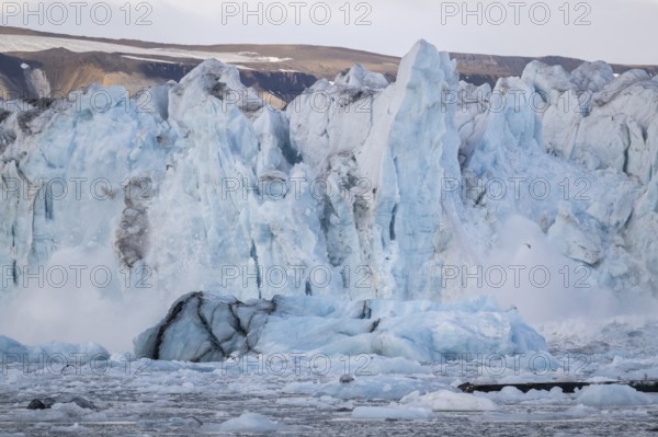 Calving glacier, calving, collapsing edge of Negribreen, Stjorfjord, Spitsbergen Island, Svalbard