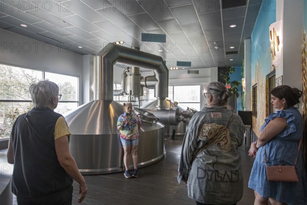 Covington, Louisiana - The Abita Brewing Company's craft beer brewery. A tour guide explains the