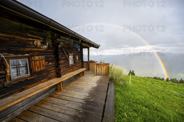Mountain hut in the rain with rainbow, Hochbrixen, Brixen im Thale, Kitzbühel Alps, Tyrol, Austria,