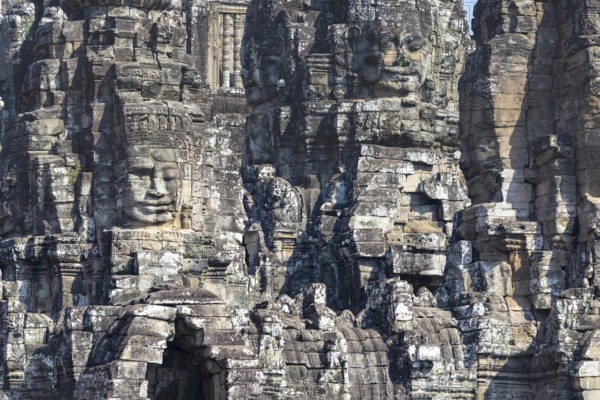 Panoramic image of giant stone-carved faces of the Bodhisattva Lokeshvara, also known as