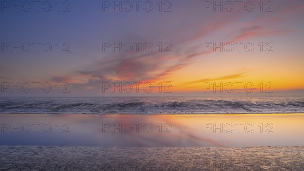 View of a tidal flat in the Wadden Sea at low tide at sunset, National Park, Unesco, World Natural