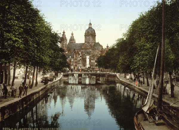 The Oudezijds Voorburgwal canal and the Sint Nicolaaskerk, St Nicholas Church, in Amsterdam,