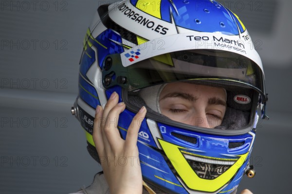 10 May 2024, Hockenheimring Germany : Spanish racing driver Alba Vazquez puts on her helmet and