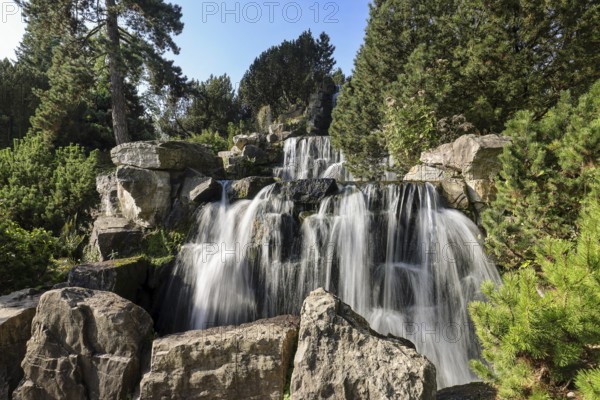Essen, North Rhine-Westphalia, Germany - Alpinum with waterfall, Grugapark, a park in Essen,