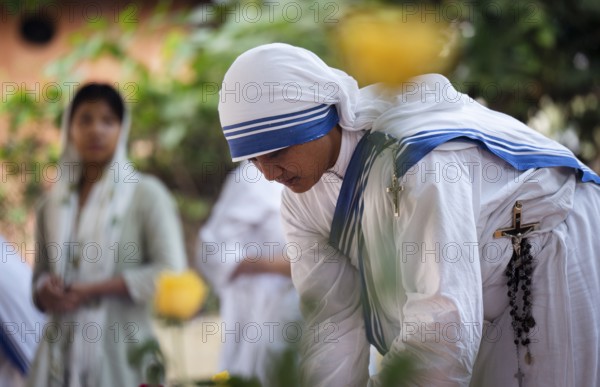 Nuns offer prayers on the grave during the All souls day observation, in Guwahati, India on 2