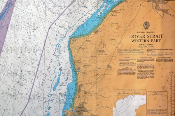 Close-up of nautical map with compass rose of the Dover Strait marking the boundary between the