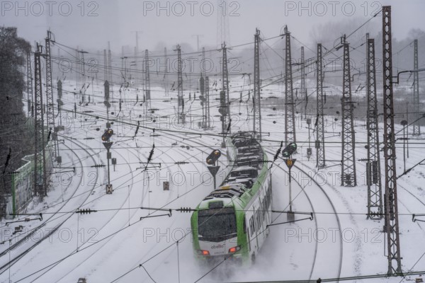 Onset of winter with lots of fresh snow and temperatures below -5 degrees during the day, railway