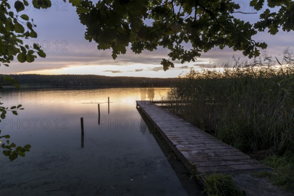 Ghost figures on the bathing jetty, evening mood on the bathing jetty of the Großer Glubigsee near