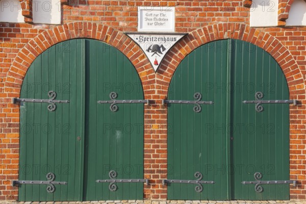 View of two green wooden gates of a fire station, Bücken, Hoya, Nienburg, Lower Saxony, Germany,