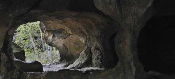 The Hohllay cave showing grooves and circles in the sandstone rock from carving millstones,