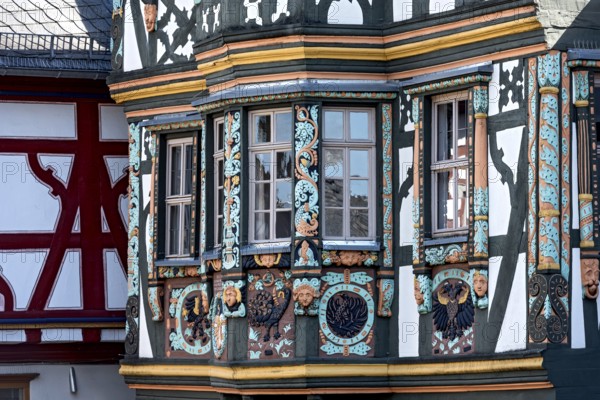 Killingerhaus, magnificent half-timbered house, colourful painted carvings on the bay window,