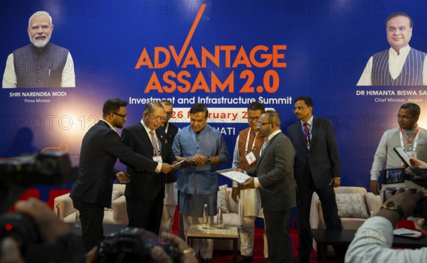 Assam Chief Minister Himanta Bishwa Sarma with investors on a MoU sign function during The