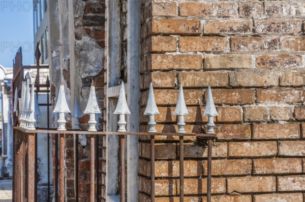 Arrowhead spikes on wrought iron fence at an above ground grave in St. Louis Cemetery No. 1 in New