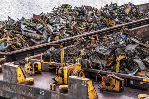 Push barge, loaded with scrap metal, for recycling, melting down, in the harbour canal,