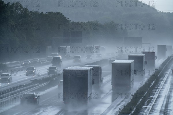A2 motorway, at Recklinghausen motorway junction, heavy traffic during a thunderstorm, North