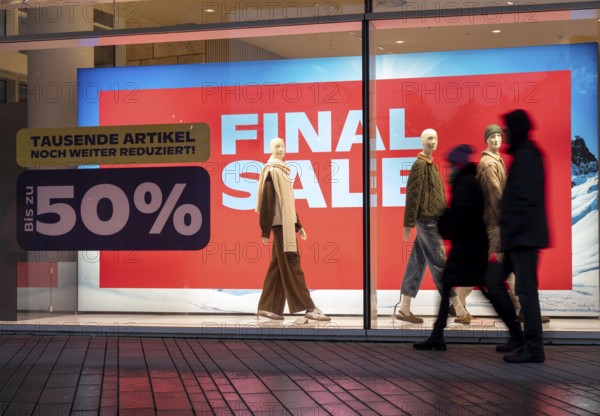 Final Sale, Clothing department stores' on Schadowstraße, large poster in the shop window