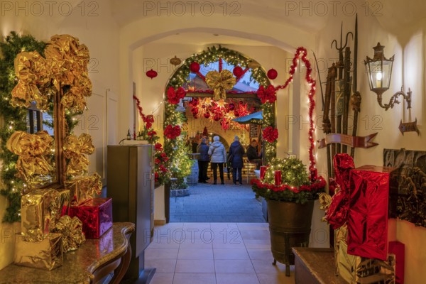 Christmas decorated passage to the mulled wine stand in the side passage at the Christmas market,