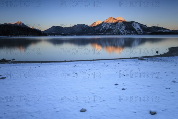 Sunrise over mountain lake, reflection, winter, Walchensee, view of Herzogstand and Heimgarten,