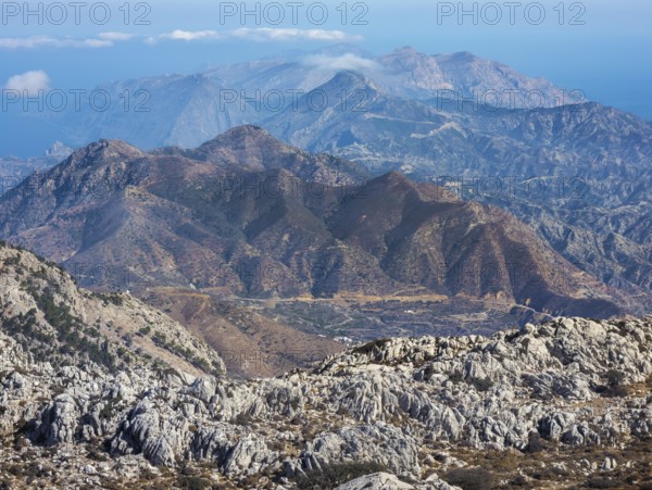 Deep view into the rough mountain and valley structure with blue and brown shades of northern