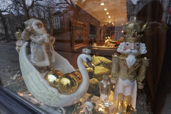 Artistically decorated window with Christmas figures and swan, Hotel Die Swaene, Bruges, West