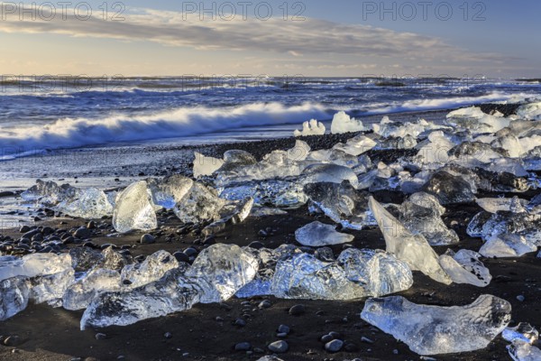 Ice floes on the beach, waves, sea, sunny, morning light, winter, Diamond Beach,