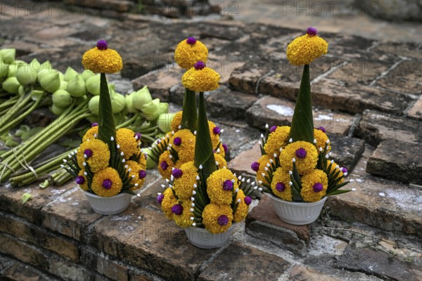 Offerings in front of the reclining Buddha, Wat Lokayasutharam, temple of the reclining Buddha,