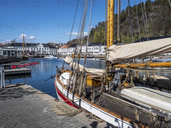 At the seaside in Risor, a traditional village with wooden white houses at the southern norwegian
