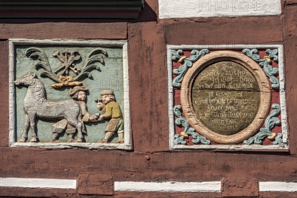 Colourful painted carvings, relief for blacksmith Johenrich Jung, medallion with inscription, on