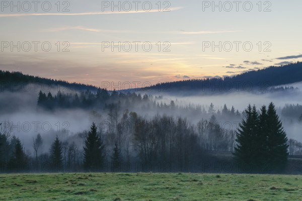 Autumnal evening mood with fog in the valley and in the forests of the Bavarian Forest National