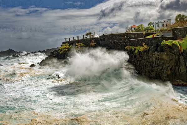 High waves on the rocks of Porto Moniz, surf on the Atlantic Ocean, storm, clouds, Porto Moniz,