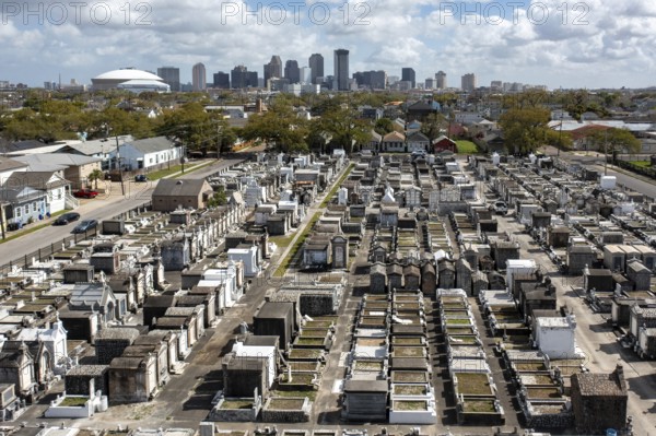 New Orleans, Louisiana - An aerial view of St. Joseph Cemetery #1, with the downtown skyline in the