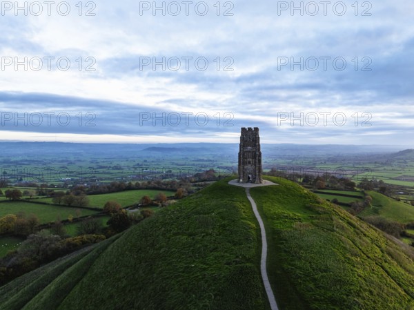Sunrise over Glastonbury Tor from a drone at autumn, Glastonbury, Somerset, England, United