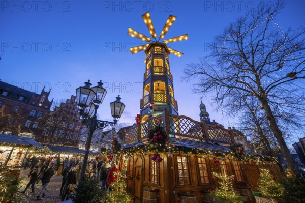 Large Christmas pyramid at the Christmas market on the market square, Lüneburg, Lower Saxony,