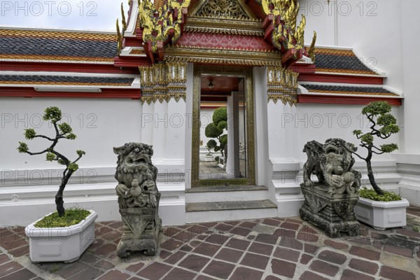 Stone statues of Chinese warriors, guardians, Wat Pho, Temple of the Reclining Buddha, Bangkok,
